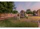 Backyard featuring a play structure with swings and slide for , perfect for Gathering fun and recreation at 1758 E Carver Rd, Tempe, AZ 85284