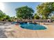 Backyard pool and waterfall feature with a concrete patio at 1758 E Carver Rd, Tempe, AZ 85284