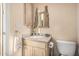 Charming powder room with unique castle-themed mirror and fixtures, adding a whimsical touch to the space at 1758 E Carver Rd, Tempe, AZ 85284