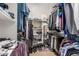 Organized walk-in closet with ample shelving, hanging rods, and shoe storage at 1758 E Carver Rd, Tempe, AZ 85284