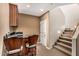 Basement wet bar with granite countertop and custom cabinetry at 1758 E Carver Rd, Tempe, AZ 85284
