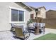 Serene backyard featuring a comfortable seating area and patio heater, ideal for outdoor gatherings at 1972 N Hubbard Ln, Casa Grande, AZ 85122