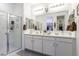 Large bathroom boasts dual sinks, quartz countertops, and a large glass shower at 1972 N Hubbard Ln, Casa Grande, AZ 85122