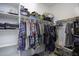 Bright, organized walk-in closet featuring built-in shelving and hanging space for clothes and accessories at 1972 N Hubbard Ln, Casa Grande, AZ 85122