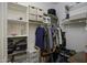 Spacious walk-in closet with ample storage, including shelves and hanging rods for organization at 1972 N Hubbard Ln, Casa Grande, AZ 85122