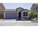 Lovely single-Gathering home with a gray roof, front yard landscaping, and two car garage at 1972 N Hubbard Ln, Casa Grande, AZ 85122