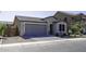Charming single-Gathering home with well-maintained landscaping, a gray roof, and a two-car garage at 1972 N Hubbard Ln, Casa Grande, AZ 85122