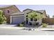 Well-kept single-Gathering home features a gray roof, landscaping, and a two-car garage at 1972 N Hubbard Ln, Casa Grande, AZ 85122