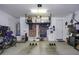 Spacious garage featuring overhead storage racks and wall decorations, ready for your vehicle at 1972 N Hubbard Ln, Casa Grande, AZ 85122