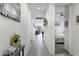 Bright hallway with tile flooring leading to a bedroom and the living area at 1972 N Hubbard Ln, Casa Grande, AZ 85122