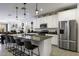 Modern kitchen with granite counters, stainless steel appliances and island seating at 1972 N Hubbard Ln, Casa Grande, AZ 85122