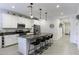Modern kitchen boasts a spacious island with seating and stainless appliances at 1972 N Hubbard Ln, Casa Grande, AZ 85122