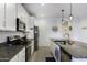 Spacious kitchen featuring granite countertops and stainless steel appliances at 1972 N Hubbard Ln, Casa Grande, AZ 85122