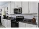 Stylish kitchen features granite countertops, stainless steel appliances and ample storage space at 1972 N Hubbard Ln, Casa Grande, AZ 85122