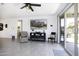 Bright living room with backyard views through sliding glass doors at 1972 N Hubbard Ln, Casa Grande, AZ 85122