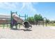 The community playground features a slide, swings, and ample play area at 1972 N Hubbard Ln, Casa Grande, AZ 85122