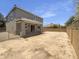 Large undeveloped backyard featuring block wall fencing and a covered patio at 21262 E Cherrywood Dr, Queen Creek, AZ 85142