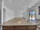 Kitchen view featuring granite countertop, stainless steel sink and appliances, and an open view to the living room at 21262 E Cherrywood Dr, Queen Creek, AZ 85142