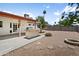Backyard featuring an outdoor kitchen, fire pit, and covered patio space; great for entertaining at 2745 E Dahlia Dr, Phoenix, AZ 85032