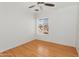 Neutral bedroom with a wood-look floor and a bright window, offering a simple design at 2745 E Dahlia Dr, Phoenix, AZ 85032