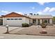 Charming single-story home with desert landscaping, a two-car garage and mature cacti at 2745 E Dahlia Dr, Phoenix, AZ 85032
