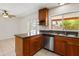 Modern kitchen with granite countertops, stainless steel appliances, and tiled floors at 2745 E Dahlia Dr, Phoenix, AZ 85032