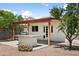 The outdoor kitchen has a built-in stainless steel BBQ grill under a covered patio in the backyard at 2745 E Dahlia Dr, Phoenix, AZ 85032