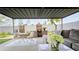 Cozy outdoor patio with a brick fireplace, comfortable seating, and lush greenery, perfect for relaxing and entertaining at 3128 E Desert Cove Ave, Phoenix, AZ 85028