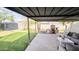 Spacious backyard featuring an outdoor patio with a fireplace, comfortable seating, and artificial turf for low maintenance at 3128 E Desert Cove Ave, Phoenix, AZ 85028