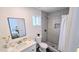 Modern bathroom featuring a stylish vanity, sleek toilet, and tiled shower, providing a clean and inviting space at 3128 E Desert Cove Ave, Phoenix, AZ 85028