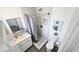 Elegant bathroom with a modern vanity, sleek mirror, and stylish shower, creating a luxurious experience at 3128 E Desert Cove Ave, Phoenix, AZ 85028