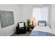 Cozy bedroom with a comfortable chair, decorative pillow, and natural light, creating a serene atmosphere at 3128 E Desert Cove Ave, Phoenix, AZ 85028