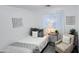 Cozy bedroom featuring a twin bed, neutral decor, and ample natural light at 3128 E Desert Cove Ave, Phoenix, AZ 85028