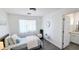 Bright bedroom with a comfy bed, sheer curtains, and decorative accents, creating a cozy and inviting space at 3128 E Desert Cove Ave, Phoenix, AZ 85028