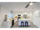 Bright and modern kitchen with stainless steel appliances, white cabinetry, and center island at 3128 E Desert Cove Ave, Phoenix, AZ 85028