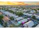 Panoramic aerial view showcasing a vibrant neighborhood with homes, pools, and colorful lighting at 3550 E Edna Ave, Phoenix, AZ 85032