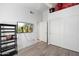 Bedroom featuring wood floors, television, and closet at 3550 E Edna Ave, Phoenix, AZ 85032