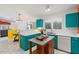 Stylish kitchen with vibrant custom cabinetry, ample counter space, and stainless steel appliances at 3550 E Edna Ave, Phoenix, AZ 85032