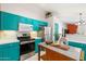 Bright modern kitchen featuring stainless steel appliances, an island, and plenty of counter space at 3550 E Edna Ave, Phoenix, AZ 85032