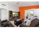 Inviting living room with TV, stylish furnishings, and easy access to the outdoor patio at 3550 E Edna Ave, Phoenix, AZ 85032