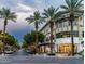 Street view of the marketplace showing storefronts, palm trees, streetlights, and storefronts at 3550 E Edna Ave, Phoenix, AZ 85032