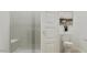 Bright bathroom featuring a glass shower with a built-in bench and a modern toilet at 3703 E Gold Mountain Ave, San Tan Valley, AZ 85143
