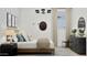 Comfortable bedroom with natural light, features a modern chandelier, stylish decor and neutral accents at 3703 E Gold Mountain Ave, San Tan Valley, AZ 85143