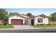 Charming single-story home with a 2-car garage and well-maintained landscaping at 3703 E Gold Mountain Ave, San Tan Valley, AZ 85143