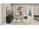 Stylish living room featuring modern artwork, comfortable seating, and a view to the outdoors at 3703 E Gold Mountain Ave, San Tan Valley, AZ 85143