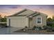 Charming single-Gathering home with a neutral color palette, an attached garage, and low-maintenance landscaping at 37683 N Dandelion Ln, San Tan Valley, AZ 85140