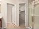 Bathroom with walk-in shower and an adjacent walk-in closet for convenience at 42424 N Gavilan Peak Pkwy # 57104, Anthem, AZ 85086