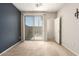 This bedroom features sliding glass doors leading to a private balcony at 42424 N Gavilan Peak Pkwy # 57104, Anthem, AZ 85086
