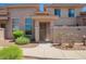 Charming condo featuring a private gated courtyard and neutral-tone stucco exterior at 42424 N Gavilan Peak Pkwy # 57104, Anthem, AZ 85086