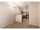 Open floor plan features a dining space and kitchen with dark cabinetry at 42424 N Gavilan Peak Pkwy # 57104, Anthem, AZ 85086